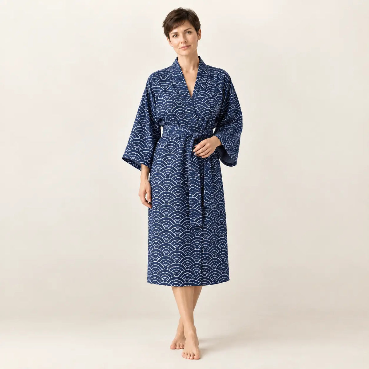 Deep blue kimono robe with white wave pattern belted waist and three quarter length sleeves from blue kimono collection Image