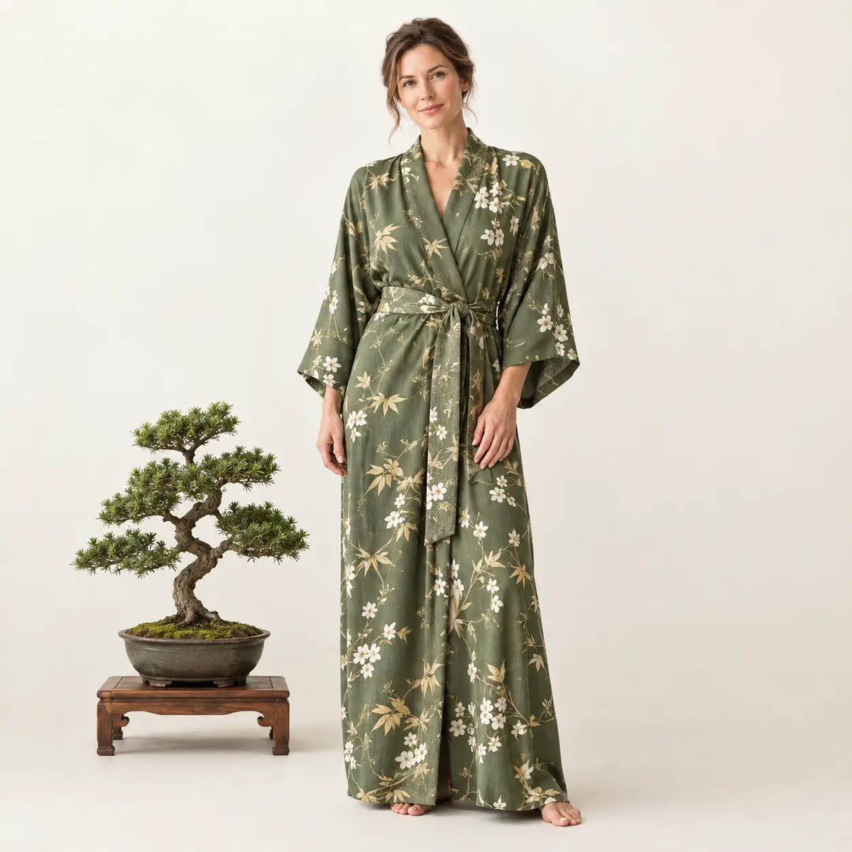 Olive green silk robe with wide sleeves and white beige floral pattern featuring a self tie belt from green kimono collection Image