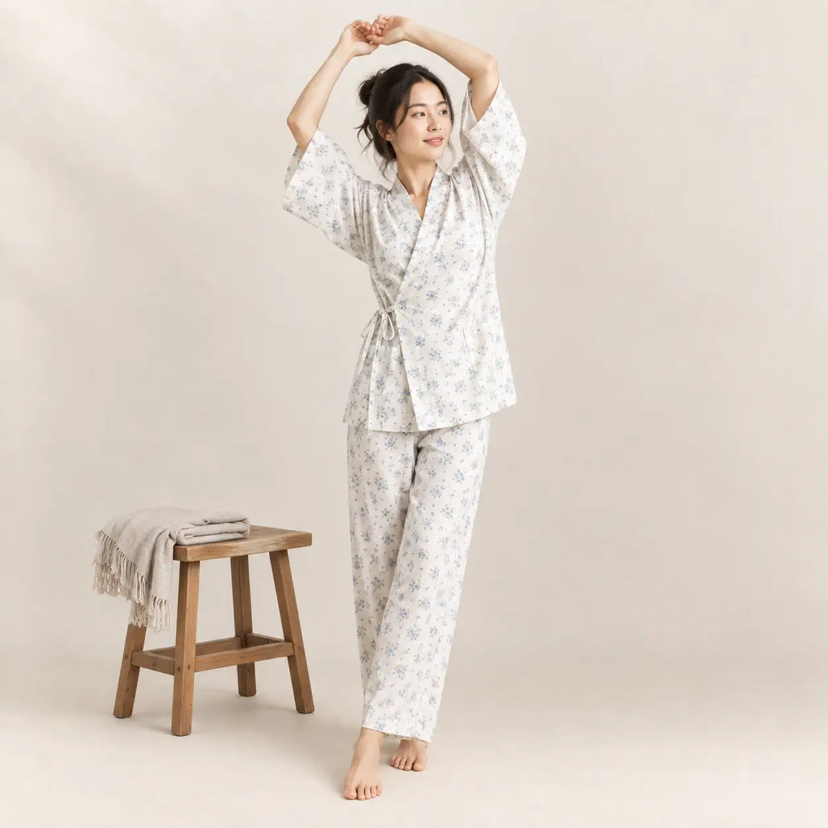 A soft light gray kimono pajama set with wrap-style top and delicate floral pattern for comfortable lounging. Image