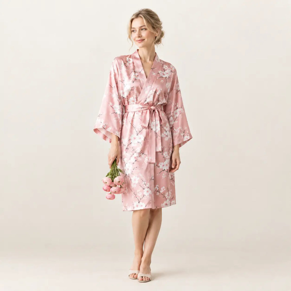 A soft pink satin robe with delicate white floral pattern and matching belt from the pink kimono collection Image