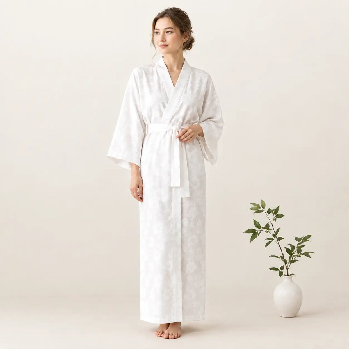 White satin robe with subtle pattern and matching belt from the white kimono collection Image