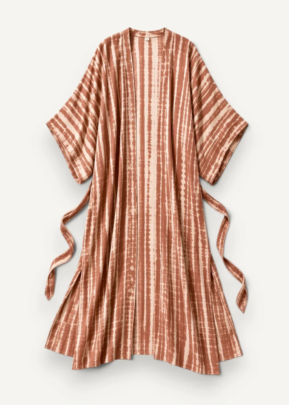 A flowing rust-colored tie-dye beach kimono maxi dress with vertical stripes and matching side ties