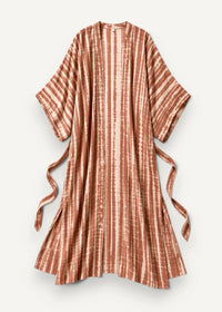 A flowing rust-colored tie-dye beach kimono maxi dress with vertical stripes and matching side ties