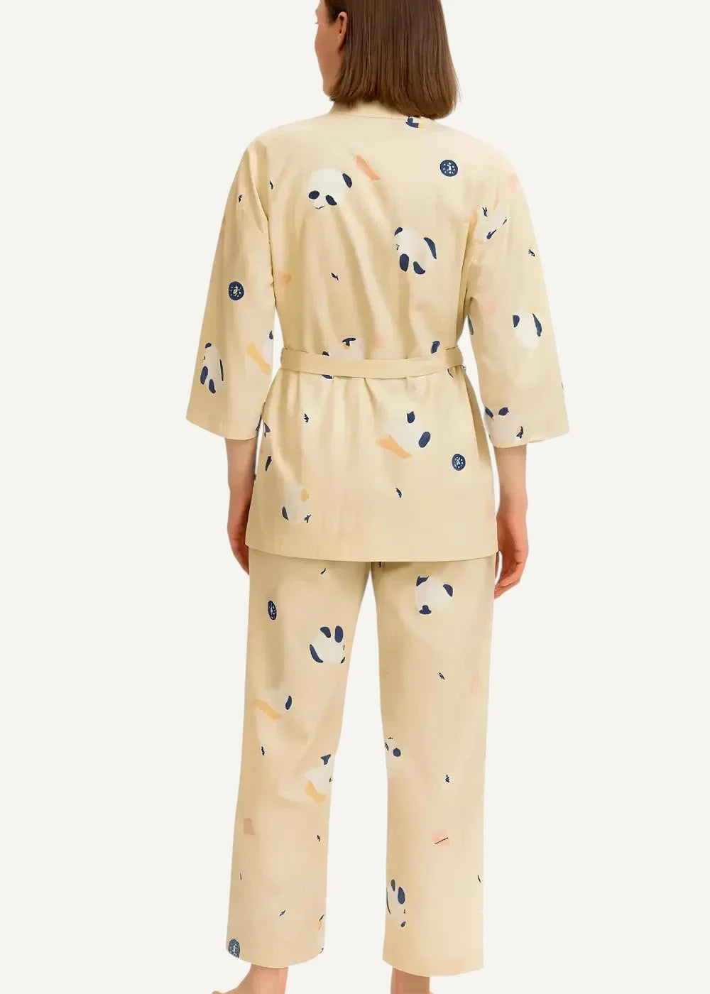 Beige women’s kimono pajamas in cream-colored fabric featuring playful panda and abstract dot patterns