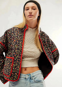 Black floral kimono jacket with quilted fabric, delicate red and green floral pattern and bold red trim on edges and pockets
