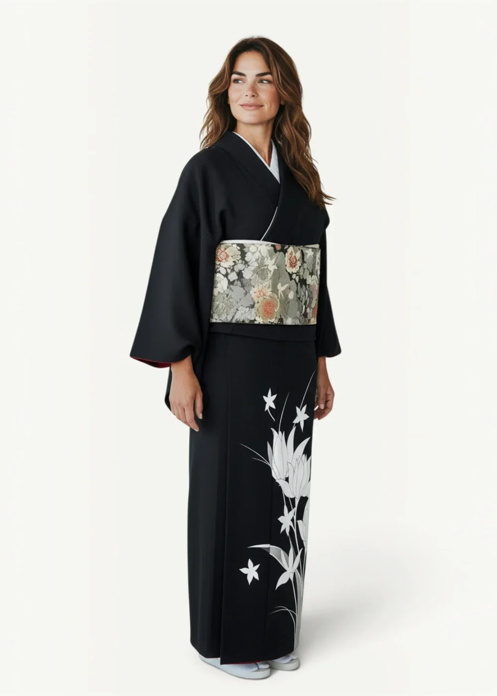 Black floral kimono with white floral embroidery and patterned obi belt in traditional japanese style