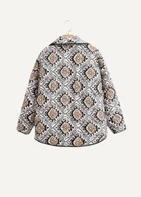 Black haori cozy long-sleeved jacket with bold black white and beige geometric diamond pattern and ornate detailing
