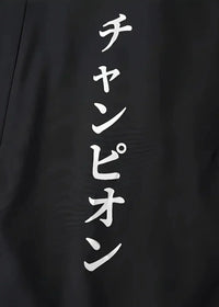 Black haori jacket showing back side with white vertical lettering on a lightweight black fabric