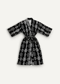 Black kimono dress with white geometric patterns and matching belt made from lightweight fabric for stylish wear