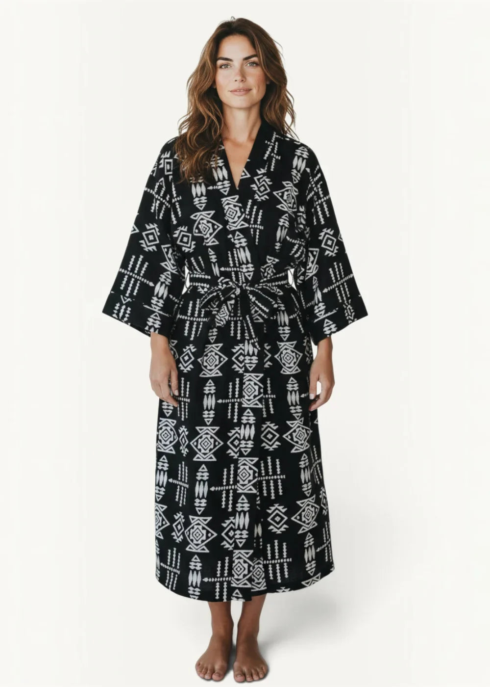 Black kimono dress with black and white geometric pattern and belted waist in lightweight fabric