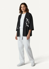 Black kimono jacket men featuring black embroidered crane with white stitching details on the front side
