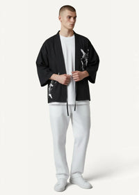 Black kimono jacket for men with white floral and bird embroidery on black fabric for stylish layering