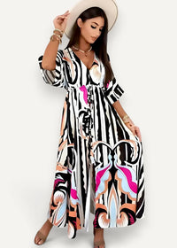 Black kimono maxi dress featuring a flowing design with bold black white pink and peach abstract patterns