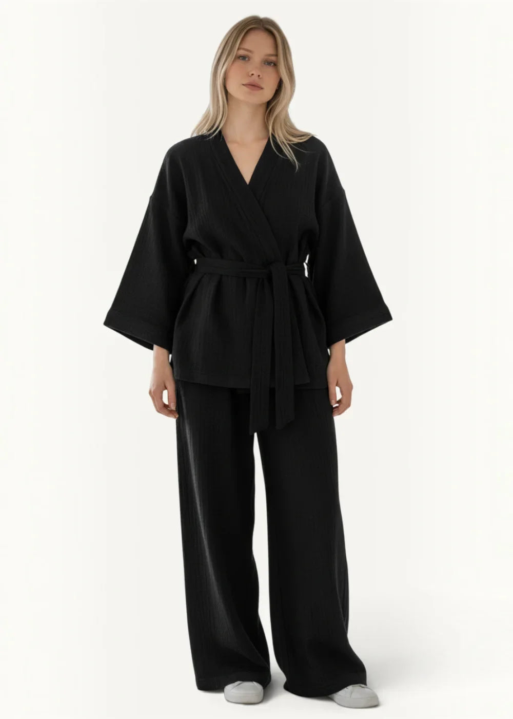 Black kimono pajamas featuring oversized top with wide sleeves and a matching belt for comfortable loungewear