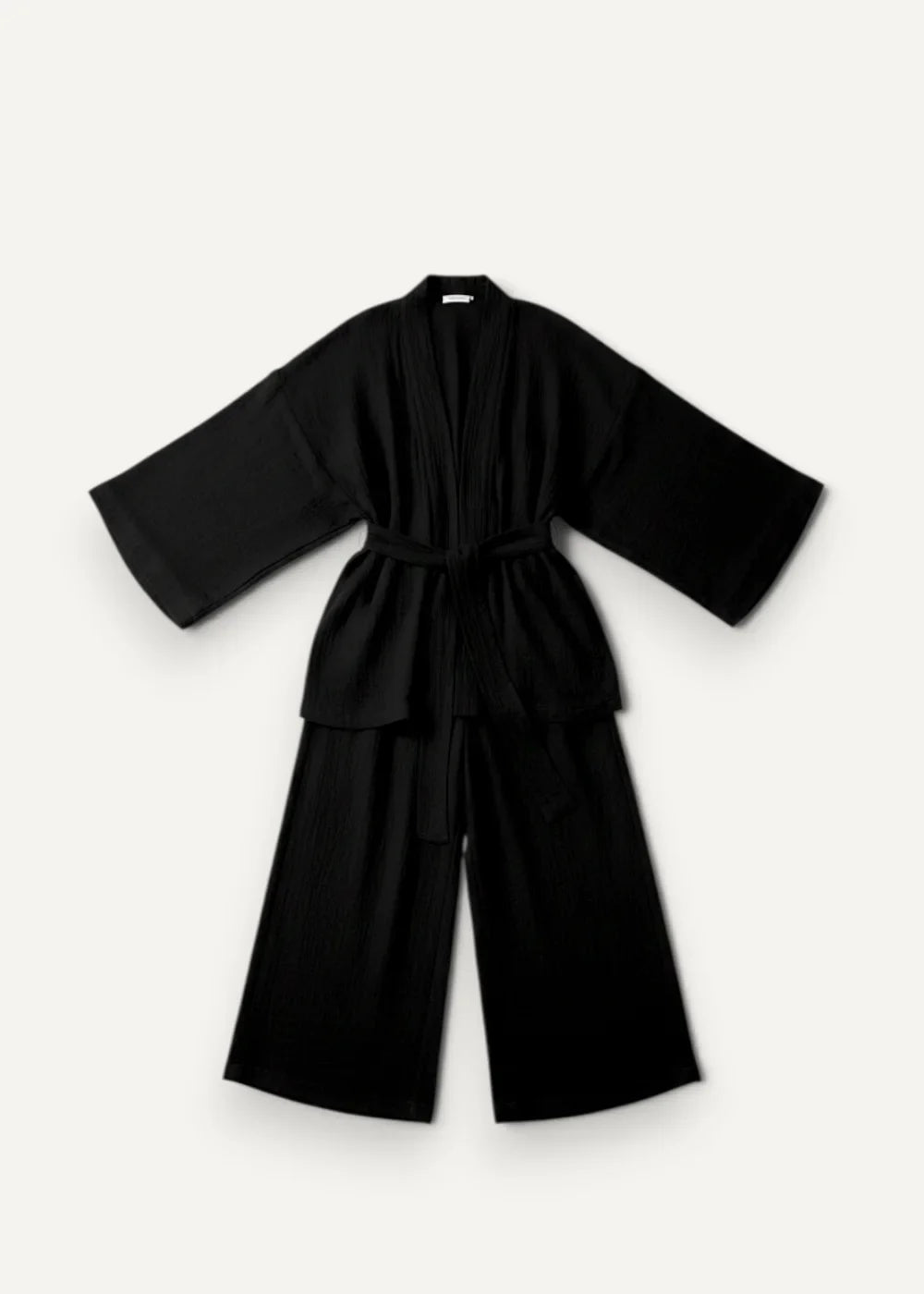Black kimono pajamas made of soft fabric with wide sleeves and matching belt for comfortable loungewear
