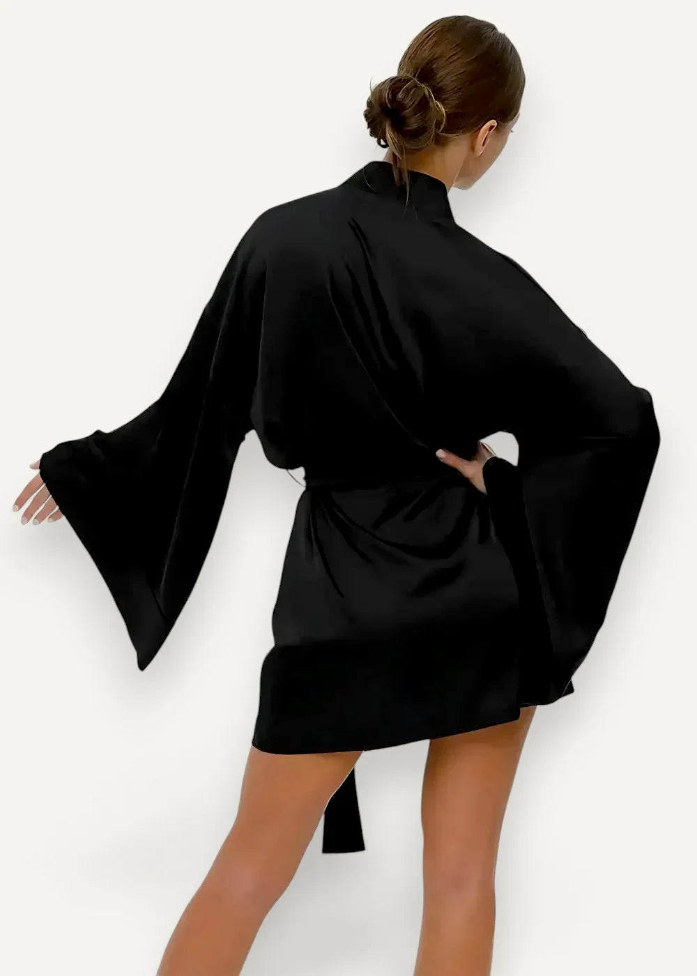 Black satin robe with wide flowing sleeves and tied waistband for comfortable elegant loungewear