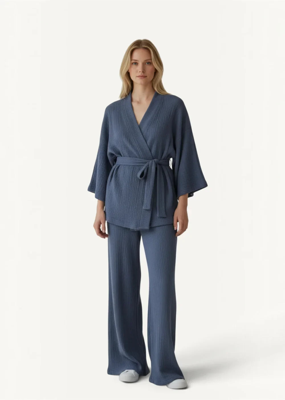 A soft ribbed navy blue cotton kimono pajama set with a belted top and wide-leg pants for lounging