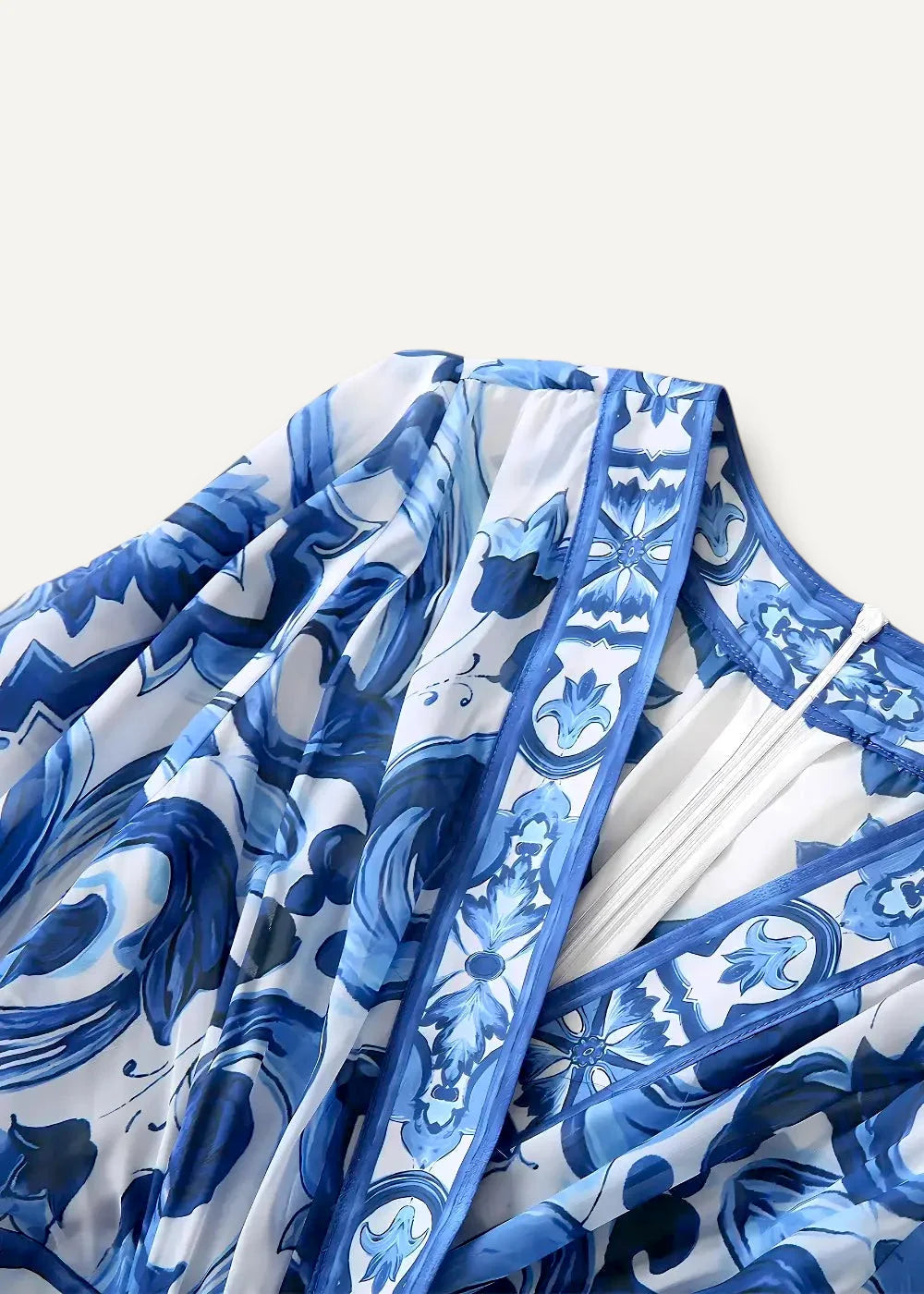 A flowing blue and white floral kimono dress with intricate patterns ideal for casual or elegant occasions