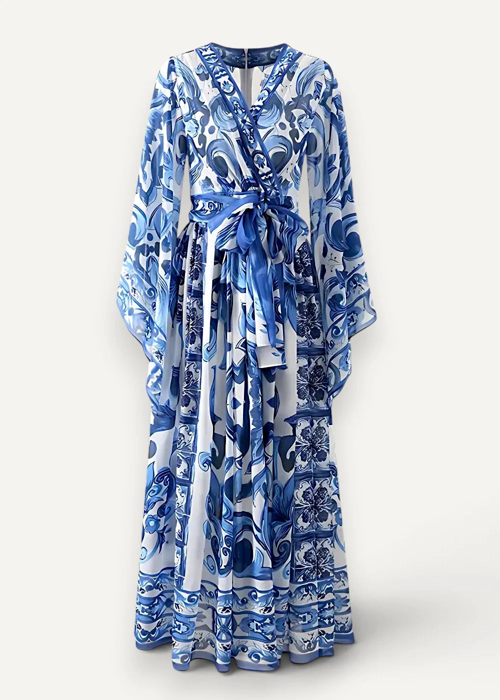 Blue floral kimono dress in flowing blue and white patterned fabric with v-neckline long sleeves and self-tie belt