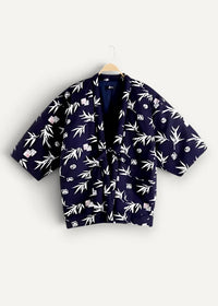 Dark blue kimono-style jacket by blue blue japan featuring white bamboo and dice patterns on fabric