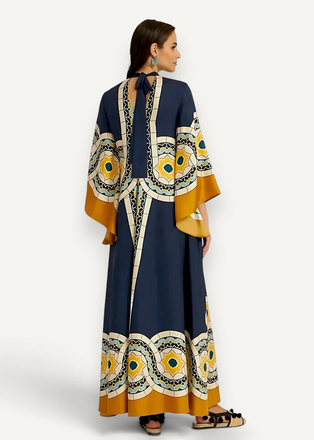 Back view of a blue japanese kimono dress featuring a navy blue and mustard yellow maxi dress with geometric patterns and a tie detail
