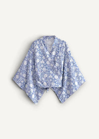 Blue kimono cardigan with light blue and white floral pattern and wide sleeves in lightweight fabric