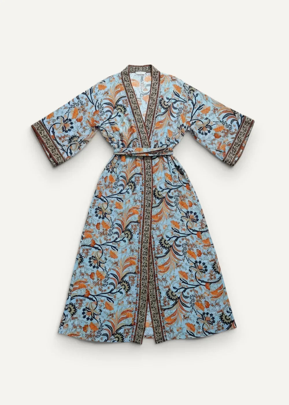 Light blue kimono maxi dress with orange and black floral botanical patterns, matching belt, and decorative edge trim