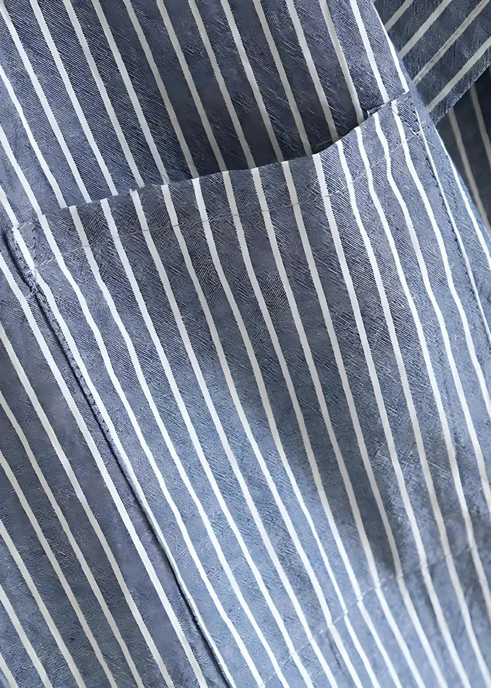 Blue kimono pajamas featuring a blue and white vertically striped cotton shirt pocket detail