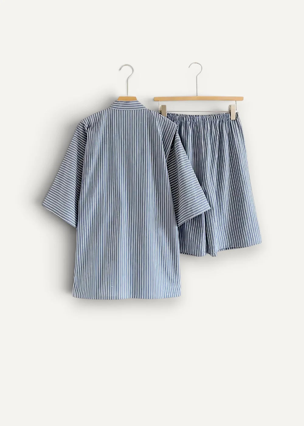 Blue kimono pajamas featuring a blue and white vertically striped cotton short sleeve top and loose fitting shorts