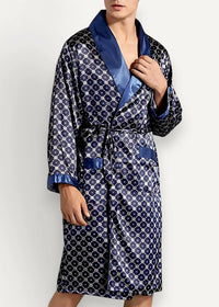 Blue kimono robe made of navy blue satin with lighter geometric pattern and royal blue trim on collar cuffs and belt