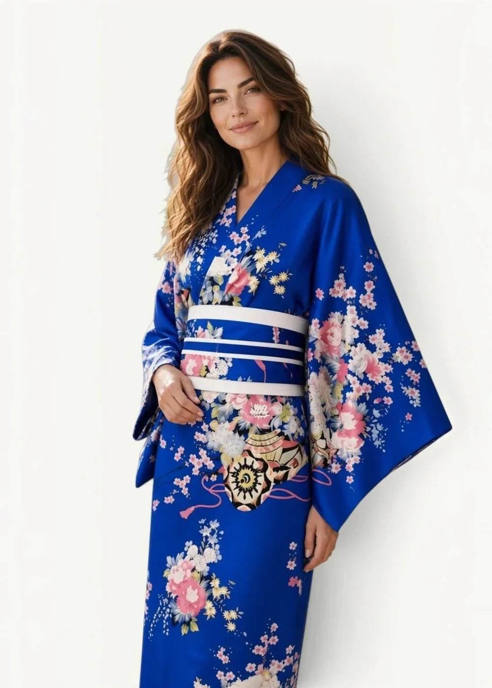 Blue kimono traditional with vibrant royal blue fabric and delicate pink white floral patterns and white striped obi belt