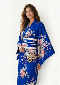 Blue kimono traditional with vibrant royal blue fabric and delicate pink white floral patterns and white striped obi belt