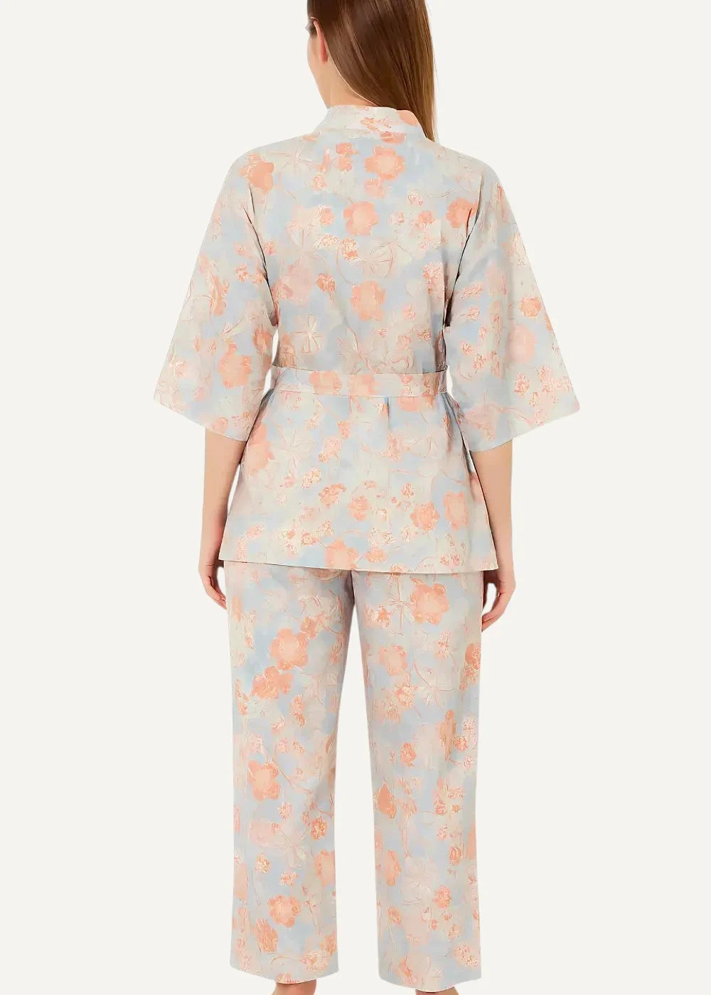Blue long kimono pajamas featuring a soft pastel blue and peach floral print with a belted top and wide-leg pants