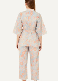 Blue long kimono pajamas featuring a soft pastel blue and peach floral print with a belted top and wide-leg pants