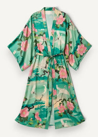 A flowing green boho hippie kimono robe with pink blossoms and white cranes on satin-like fabric