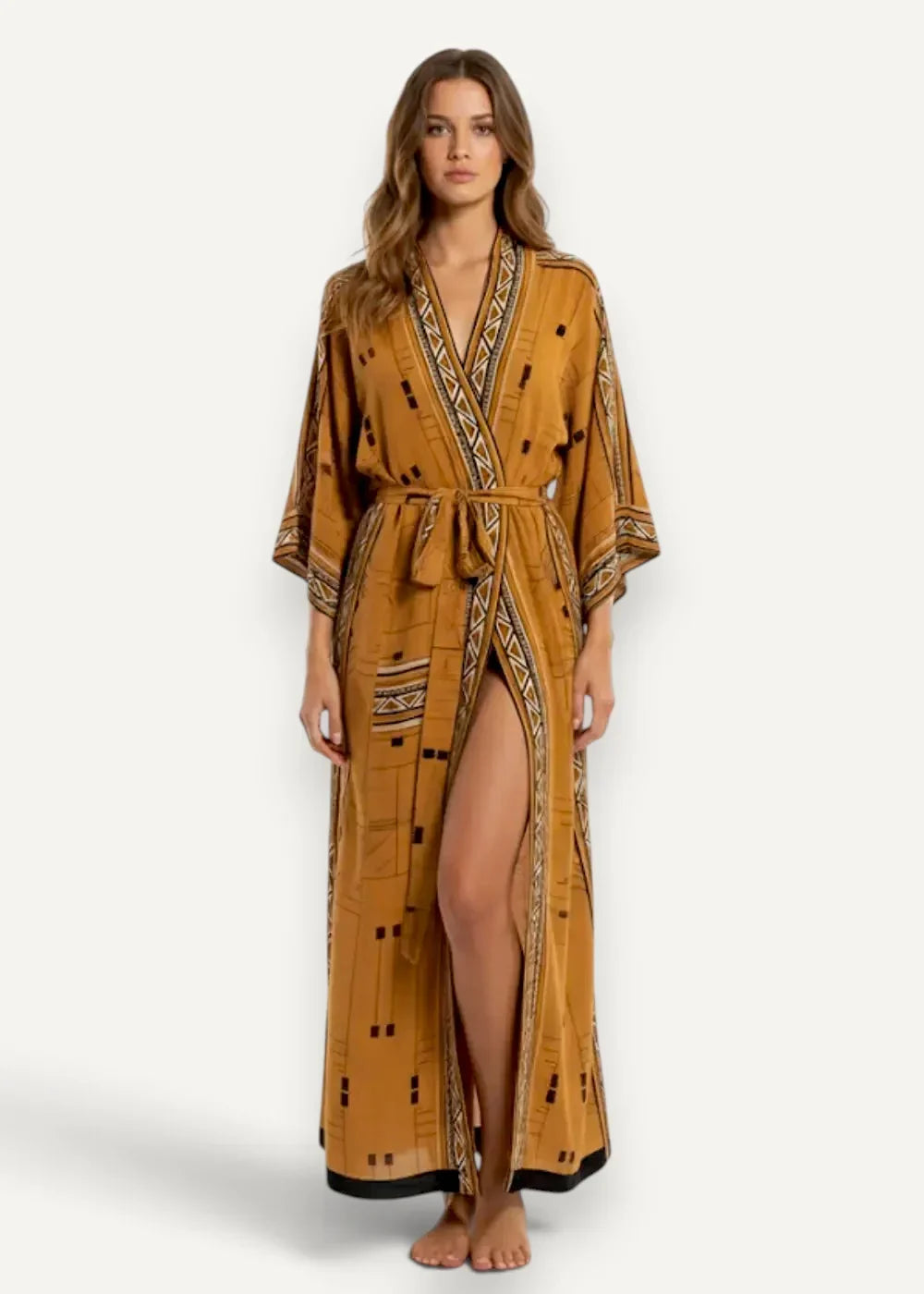 A flowing mustard-yellow boho kimono dress with intricate geometric dot patterns, tie belt, and high side slit