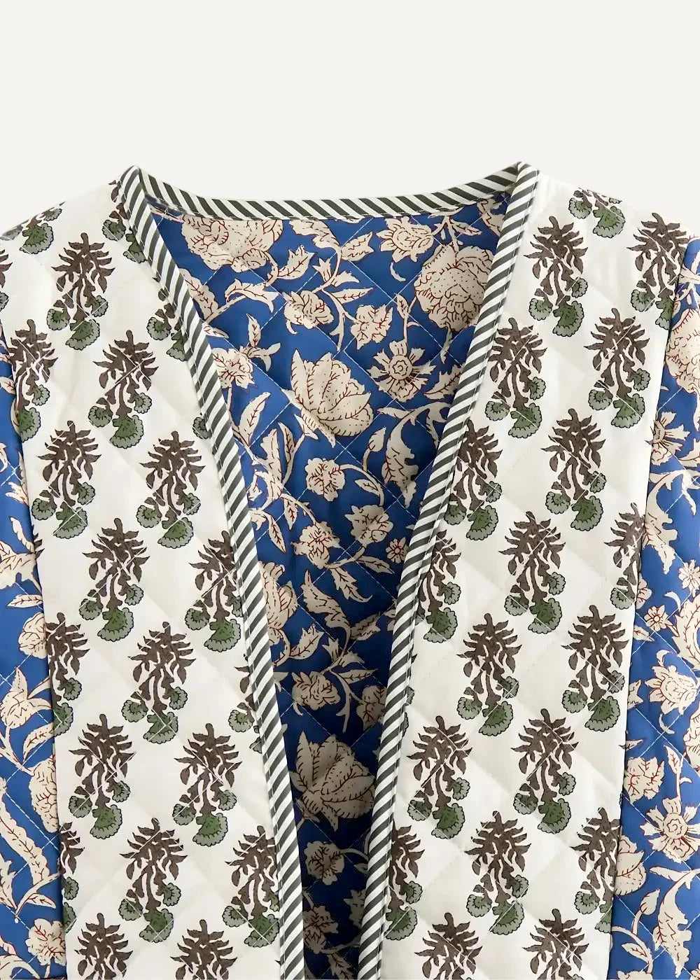 Boho kimono jacket quilted with white exterior brown and green floral patterns and vibrant blue floral interior