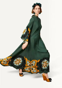 Boho kimono maxi dress in flowing emerald green with intricate orange and black floral patterns on hem and bell sleeves