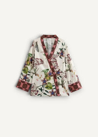 Cream-colored boho short kimono jacket with vibrant floral bird pattern and burgundy trim on collar cuffs and placket
