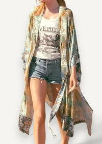 Boho style kimono cardigan in a flowing long-sleeved design with muted green and gold floral patterns