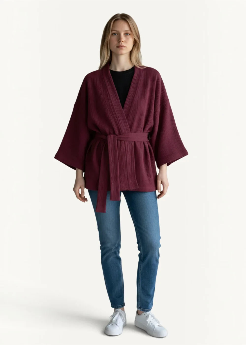 A burgundy loose-fitting kimono pajama top with wide sleeves and a belted waist for comfortable loungewear