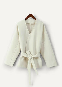 Cream-colored casual kimono jacket with long sleeves belt waist and soft fabric wrap design