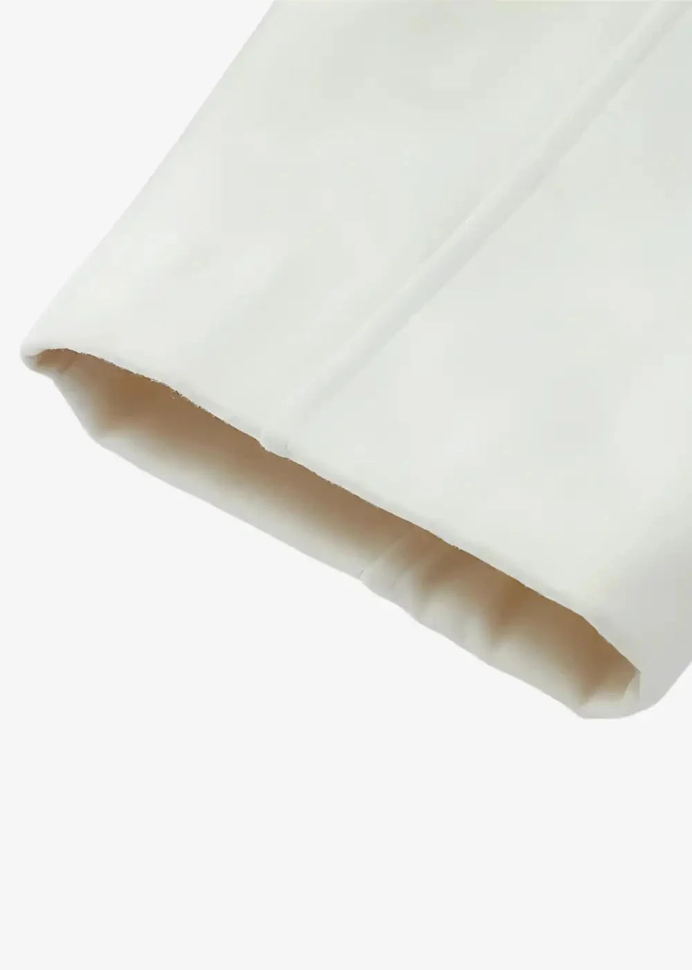 A casual kimono jacket sleeve made of soft off-white fabric with smooth texture and neatly stitched edges
