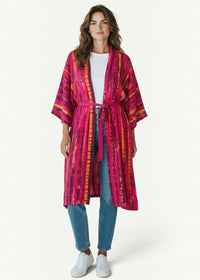 A vibrant pink and orange tie-dye chiffon beach kimono with matching belt made of lightweight fabric