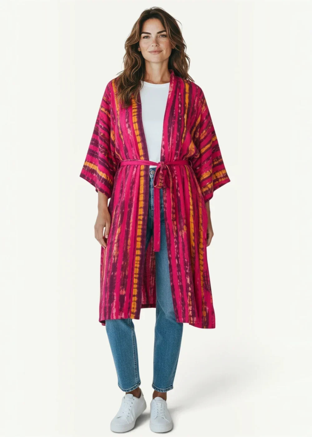 A vibrant pink and orange tie-dye chiffon beach kimono with matching belt made of lightweight fabric