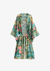 A flowing chiffon cover up kimono in teal and pink floral print with wide sleeves and a matching belt