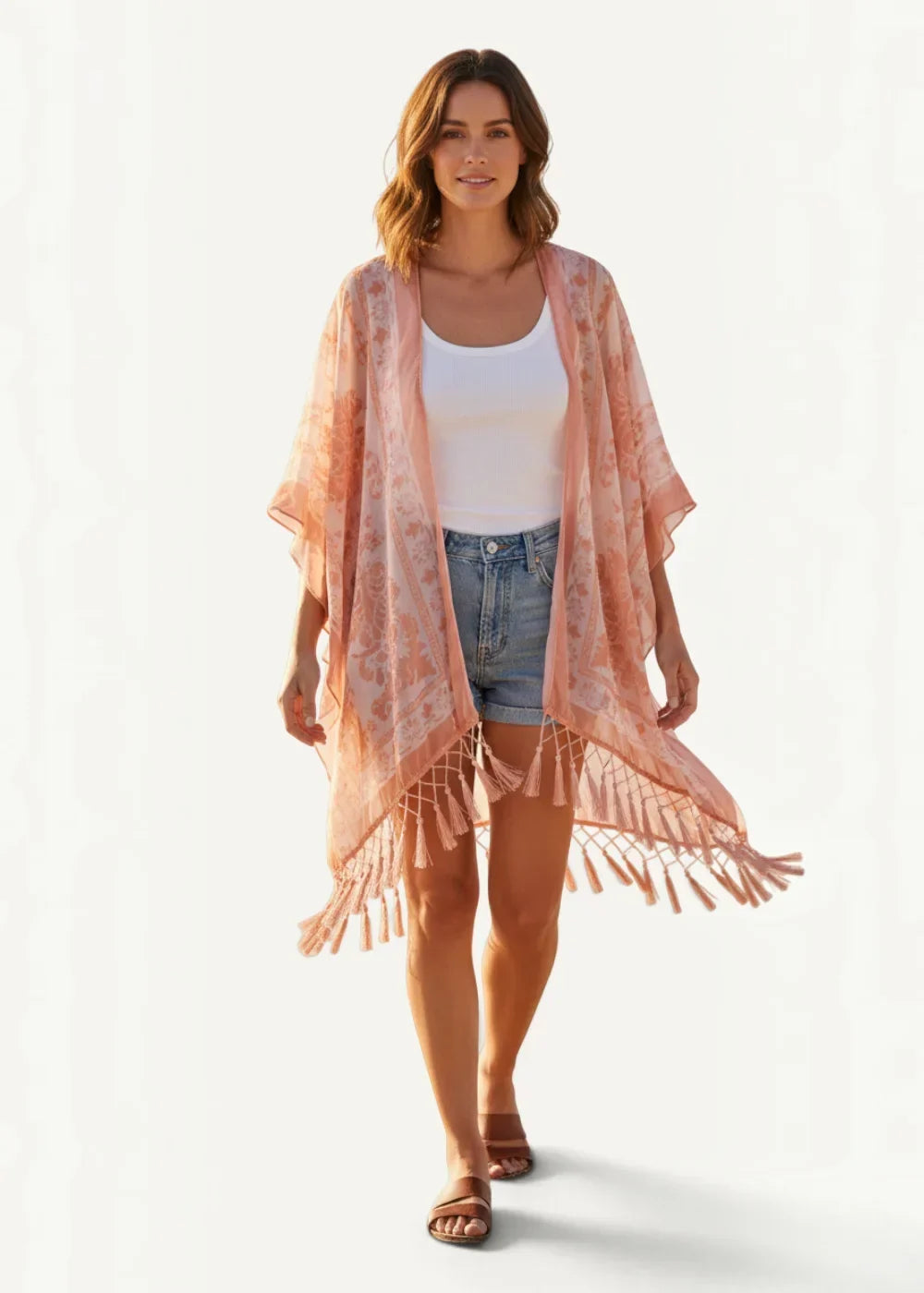Sheer pink chiffon kimono jacket with flowing fabric, subtle floral pattern, and decorative tassels along the hem