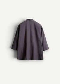 Dark gray minimalist cotton haori jacket with relaxed fit and three quarter sleeves shown from the back side