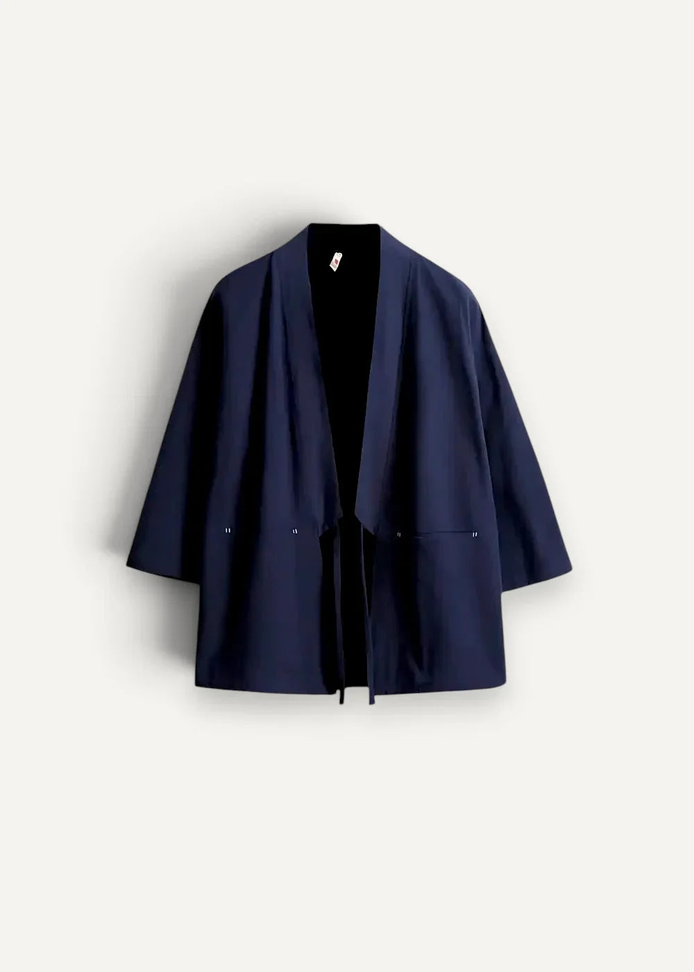 Deep navy blue minimalist cotton haori jacket with loose fit and subtle front pockets in Japanese style