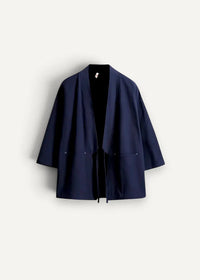 Deep navy blue minimalist cotton haori jacket with loose fit and subtle front pockets in Japanese style